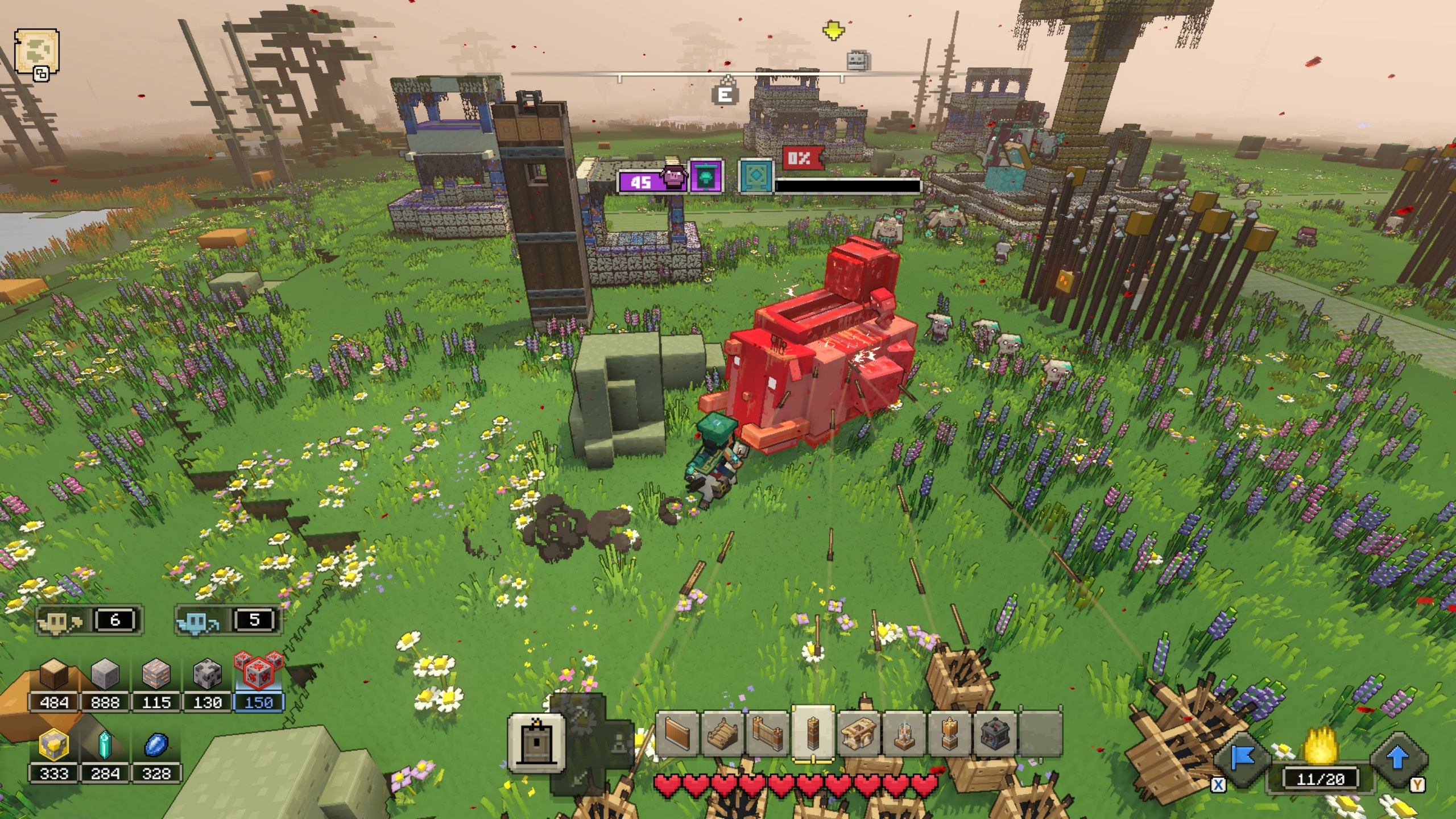 Minecraft Legends: un jugador y sus golems de tablones atacan a un elefante lanzador de lavales para defender una aldea
