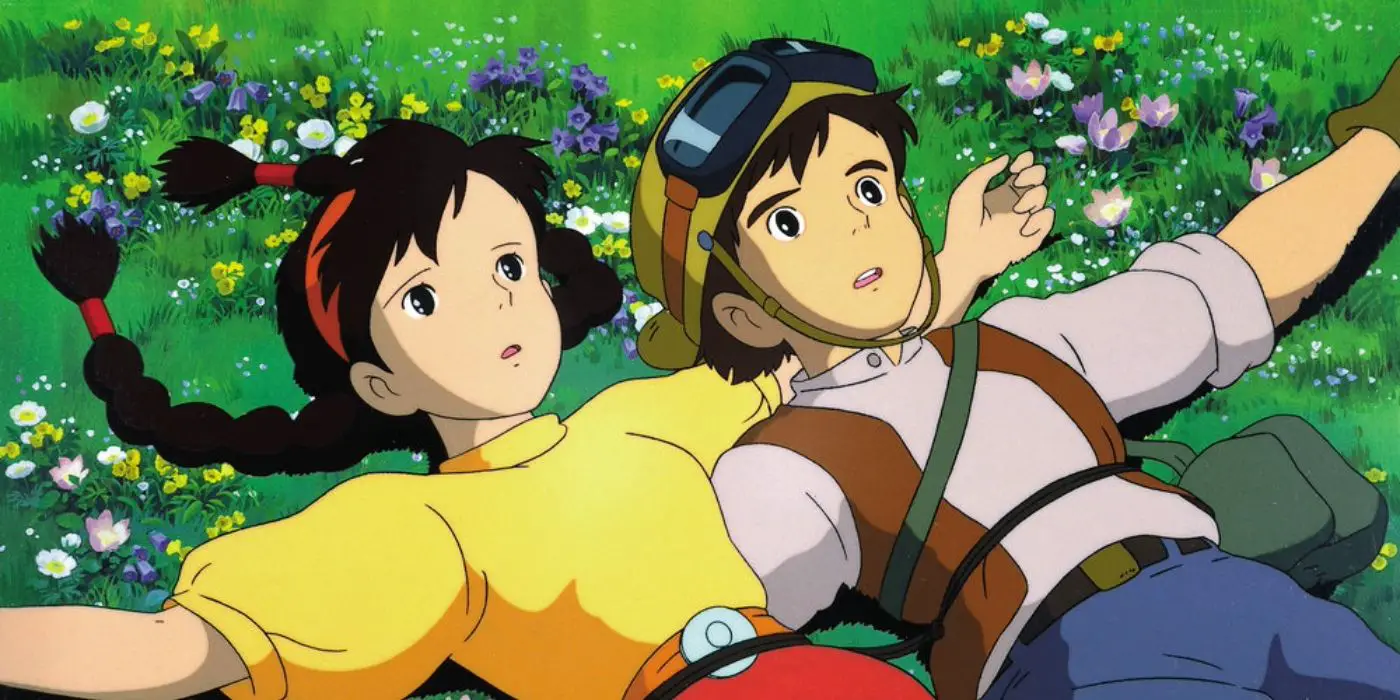 Sheeta y Pazu tumbados en un campo en 'El castillo en el cielo' de Studio Ghibli.