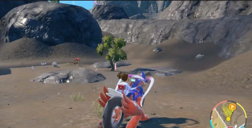 Personaje jugador montando a Koraidon explorando el Bioma del Cañón en el DLC Pokémon Escarlata y Violeta.