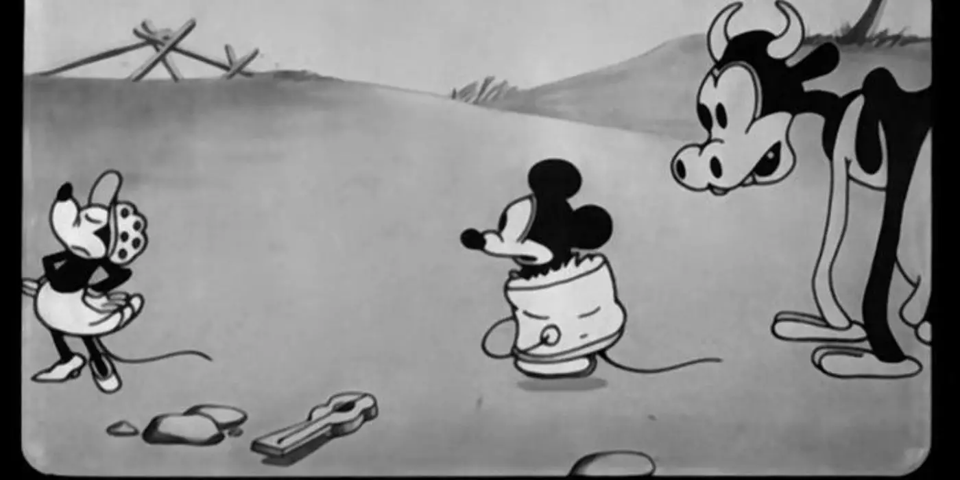 Minnie deja a Mickey en un cubo mientras una vaca observa
