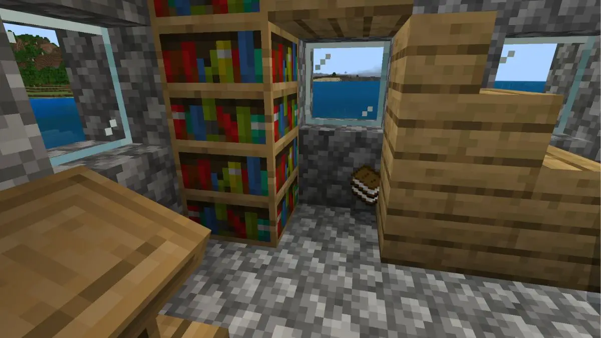 Estanterías en una aldea en Minecraft, con libros en el suelo.